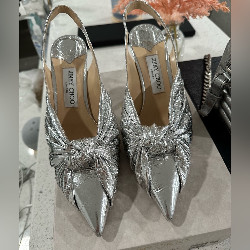 Metallic silver Jimmy Choo sling back shoes.